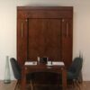 Fully set wall bed with table and chairs
